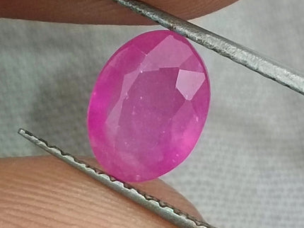 Natural untreated African ruby gemstone, 1.31ct, oval cut, pinkish red color, transparent clarity, GSI certified.