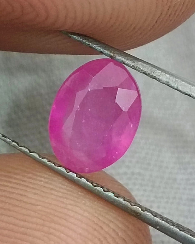 Natural untreated African ruby gemstone, 1.31ct, oval cut, pinkish red color, transparent clarity, GSI certified.