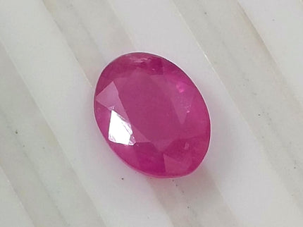Natural untreated 1.31ct pinkish red African ruby, oval shape, good cut quality, GSI certified gemstone.