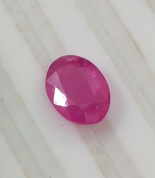 Natural untreated 1.31ct pinkish red African ruby, oval shape, good cut quality, GSI certified gemstone.