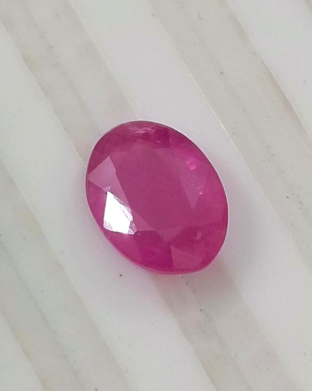 Natural untreated 1.31ct pinkish red African ruby, oval shape, good cut quality, GSI certified gemstone.