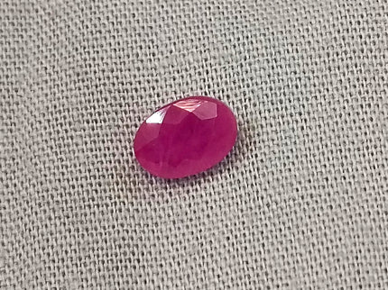 Natural untreated oval ruby gemstone, semi-transparent red color, with good cut quality, measuring 6.96*4.93*2.91mm.