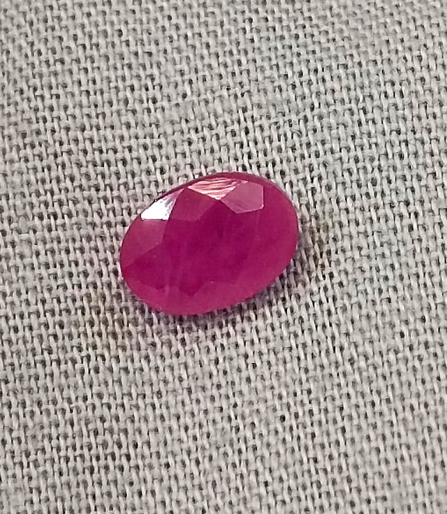Natural untreated oval ruby gemstone, semi-transparent red color, with good cut quality, measuring 6.96*4.93*2.91mm.