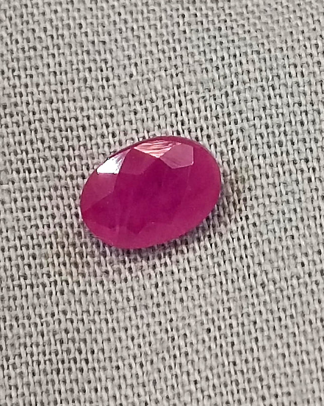 Natural untreated oval ruby gemstone, semi-transparent red color, with good cut quality, measuring 6.96*4.93*2.91mm.