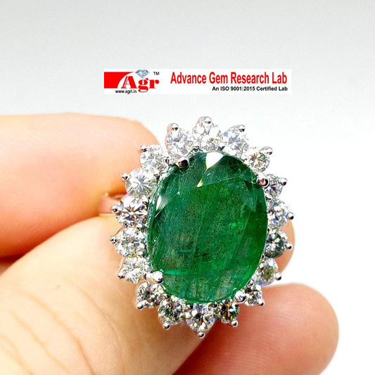 Beautiful 14kt White Gold ring set with untreated Emerald and diamonds total of 16.62ct.